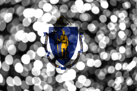 Massachusetts abstract blurry bokeh flag. Christmas, New Year and National day concept flag. United States of America.の写真素材