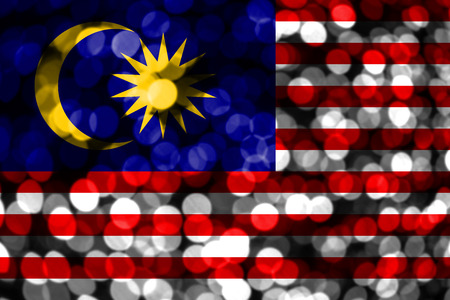 Malaysia abstract blurry bokeh flag. Christmas, New Year and National day concept flag.の写真素材