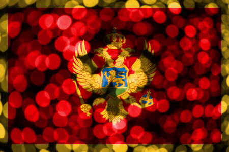 Montenegro abstract blurry bokeh flag. Christmas, New Year and National day concept flag.の写真素材