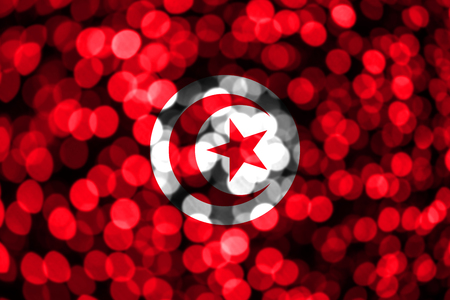 Tunisia abstract blurry bokeh flag. Christmas, New Year and National day concept flag.の写真素材