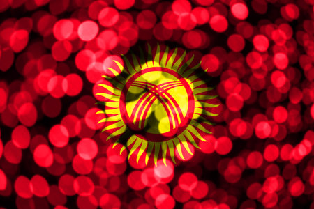 Kyrgyzstan abstract blurry bokeh flag. Christmas, New Year and National day concept flag.