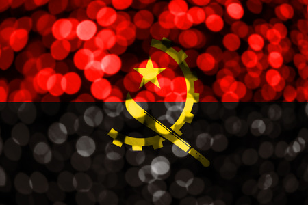 Angola abstract blurry bokeh flag. Christmas, New Year and National day concept flag.の写真素材