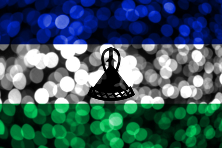 Lesotho abstract blurry bokeh flag. Christmas, New Year and National day concept flag.の写真素材