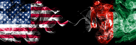 United States of America vs Afghanistan, Afghani smoky mystic flags placed side by side. Thick colored silky smoke flags of America and Afghanistan, Afghani.の写真素材