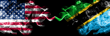 United States of America vs Tanzania, Tanzanian smoky mystic flags placed side by side. Thick colored silky smoke flags of America and Tanzania, Tanzanian.の写真素材