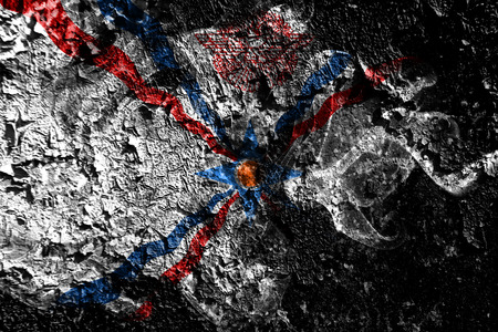 Assyria smoky mystical flag on the old dirty wall backgroundの写真素材
