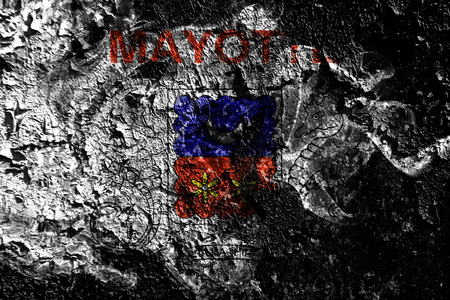France - Mayotte - France  smoky mystical flag on the old dirty wall backgroundの写真素材