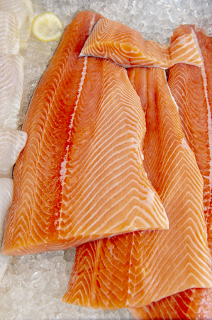 Fresh salmon filets at the marketplace storeの写真素材