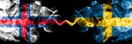 Faroe Islands, Sweden, Swedish, flip competition thick colorful smoky flags. European football qualifications gamesの写真素材