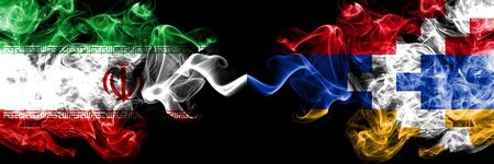 Iran vs Artsakh smoky mystic states flags placed side by side. Thick colored silky smokes flag combination of Iranian and Artsakhの写真素材