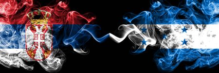 Serbia vs Honduras, Honduran smoky mystic flags placed side by side. Thick colored silky smokes combination of Serbian and Honduras, Honduran flagの写真素材