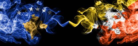 Kosovo vs Bhutan, Bhutanese smoky mystic flags placed side by side. Thick colored silky smokes combination of Kosovo and Bhutan, Bhutanese flagの写真素材