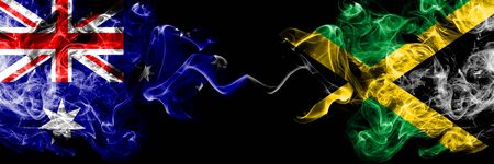 Australia vs Jamaica, Jamaican smoky mystic flags placed side by side. Thick colored silky smokes combination of national flags of Australia and Jamaica, Jamaicanの写真素材