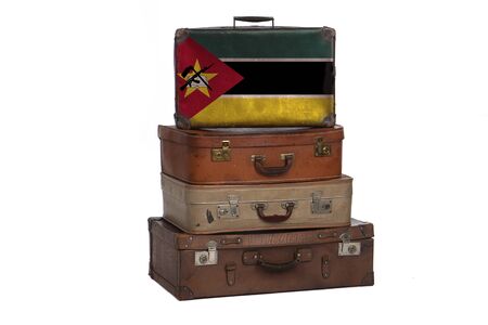 Mozambique, Mozambican travel concept. Group of vintage suitcases isolated on white backgroundの写真素材