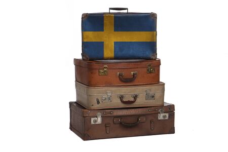 Sweden, Swedish travel concept. Group of vintage suitcases isolated on white backgroundの写真素材