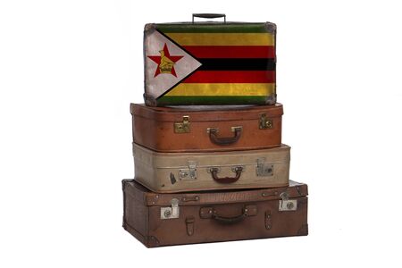 Zimbabwe, Zimbabwean travel concept. Group of vintage suitcases isolated on white backgroundの写真素材