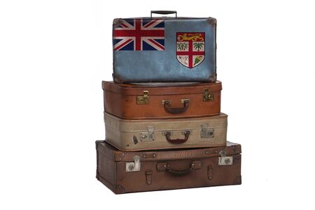 Fiji travel concept. Group of vintage suitcases isolated on white backgroundの写真素材