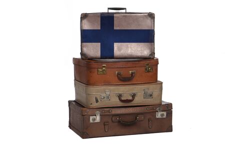 Finland, FInnish travel concept. Group of vintage suitcases isolated on white backgroundの写真素材