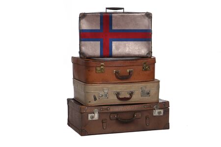 Faroe Islands travel concept. Group of vintage suitcases isolated on white backgroundの写真素材