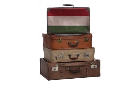 Hungary, Hungarian travel concept. Group of vintage suitcases isolated on white backgroundの写真素材
