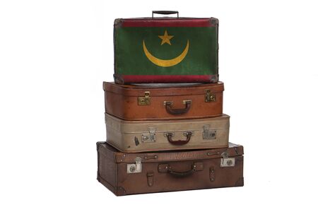 Mauritania, Mauritanian travel concept. Group of vintage suitcases isolated on white backgroundの写真素材