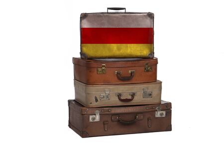 South Ossetia travel concept. Group of vintage suitcases isolated on white backgroundの写真素材