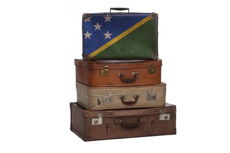 Solomon Islands travel concept. Group of vintage suitcases isolated on white backgroundの写真素材