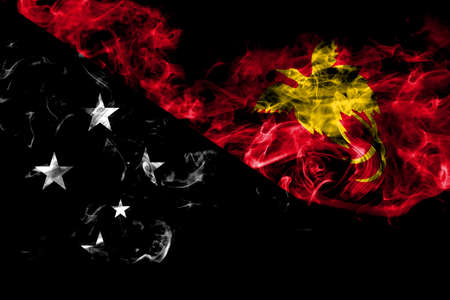 Papua New Guinea smoke flag isolated on black backgroundの写真素材
