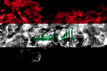 Iraq smoke flag isolated on black backgroundの写真素材