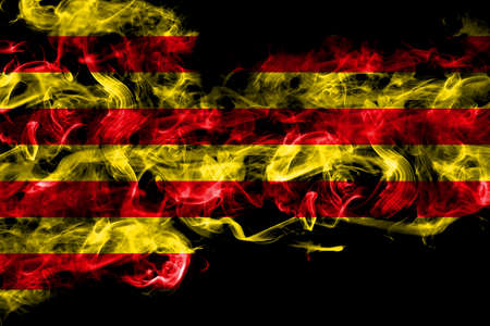 Spain, Spanish, Catalonia, Senyera smoke flag isolated on black backgroundの写真素材