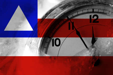 Brazil, Brazilian, Bahia flag with clock close to midnight in the background. Happy New Year conceptの写真素材