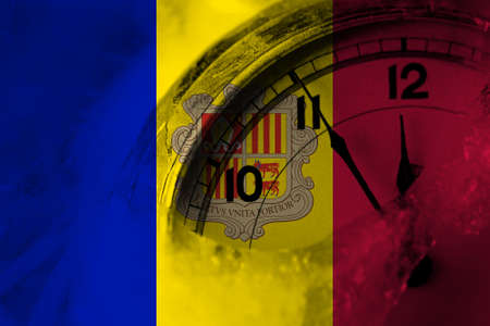 Andorra, Andorran flag with clock close to midnight in the background. Happy New Year conceptの写真素材