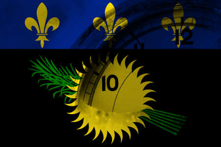 France, French, Guadeloupe flag with clock close to midnight in the background. Happy New Year conceptの写真素材