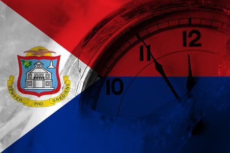 Netherlands, Dutch, Holland, Sint Maarten flag with clock close to midnight in the background. Happy New Year conceptの写真素材