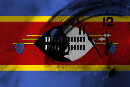 Swaziland flag with clock close to midnight in the background. Happy New Year conceptの写真素材