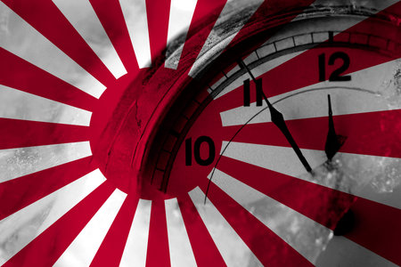 Japan, Japanese, sun flag with clock close to midnight in the background. Happy New Year concept