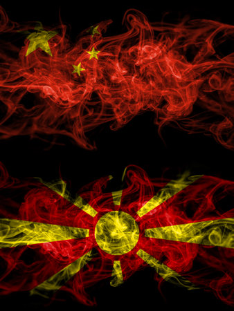China, Chinese vs Macedonia, Macedonian smoky mystic flags placed side by side. Thick colored silky abstract smoke flags.の写真素材