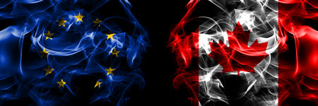 Flags of EU, European Union vs Canada, Canadian. Smoke flag placed side by side on black background.の写真素材