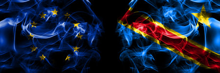 Flags of EU, European Union vs Democratic Republic of the Congo. Smoke flag placed side by side on black background.の写真素材