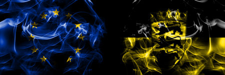 Flags of EU, European Union vs Germany, Baden Wurttemberg, state. Smoke flag placed side by side on black background.の写真素材