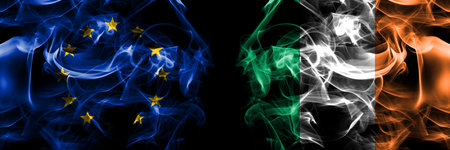 Flags of EU, European Union vs Ireland, Irish. Smoke flag placed side by side on black background.の写真素材