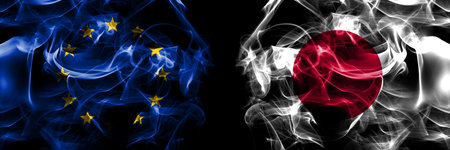 Flags of EU, European Union vs Japan, Japanese. Smoke flag placed side by side on black background.の写真素材