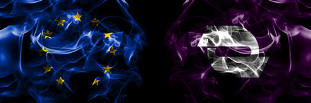 Flags of EU, European Union vs Japan, Japanese, Yuni, Hokkaido, Sorachi, Subprefecture. Smoke flag placed side by side on black background.の写真素材