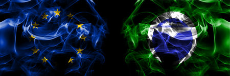 Flags of EU, European Union vs Japan, Japanese, Teshikaga, Hokkaido, Kushiro, Subprefecture. Smoke flag placed side by side on black background.の写真素材