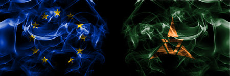 Flags of EU, European Union vs Japan, Japanese, Shosanbetsu, Hokkaido, Rumoi, Subprefecture. Smoke flag placed side by side on black background.の写真素材