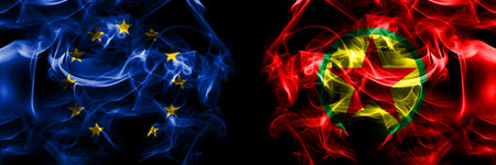 Flags of EU, European Union vs Kurdistan Workers Party. Smoke flag placed side by side on black background.の写真素材