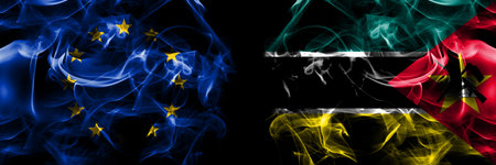Flags of EU, European Union vs Mozambique, Mozambican. Smoke flag placed side by side on black background.の写真素材