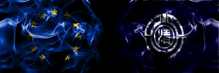 Flags of EU, European Union vs Japan, Japanese, Koshimizu, Hokkaido, Okhotsk, Subprefecture. Smoke flag placed side by side on black background.の写真素材