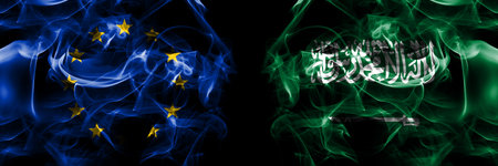 Flags of EU, European Union vs Saudi Arabia, Arabian. Smoke flag placed side by side on black background.の写真素材