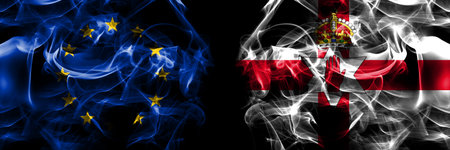 Flags of EU, European Union vs Northern Ireland. Smoke flag placed side by side on black background.の写真素材